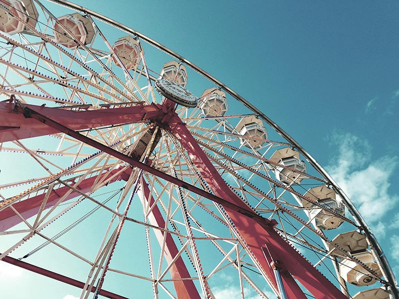 ferris wheel against blue sky